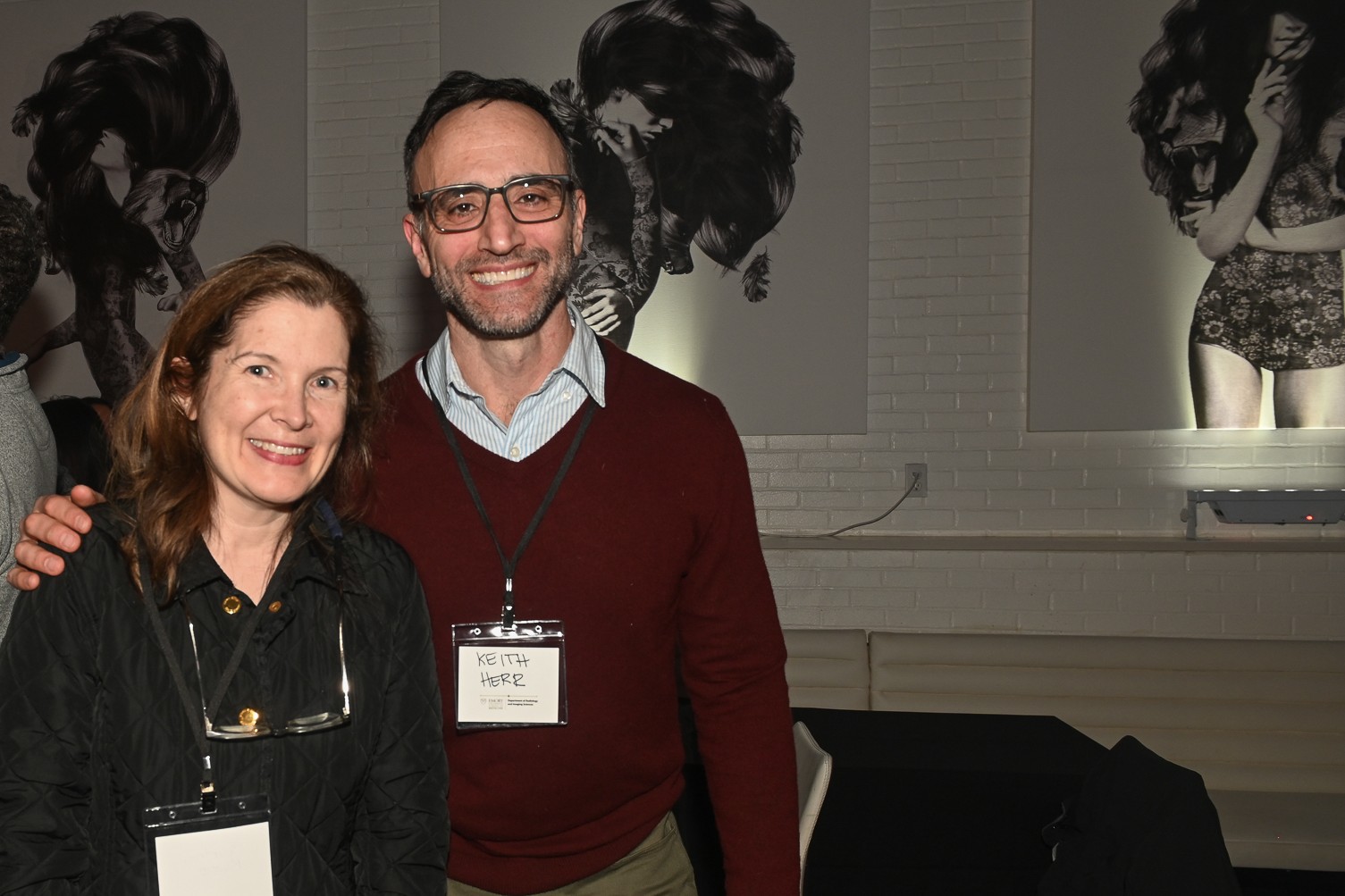 two smiling people at a party